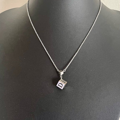 A Christian Dior Vintage Silver Tone Dice Pendant Necklace